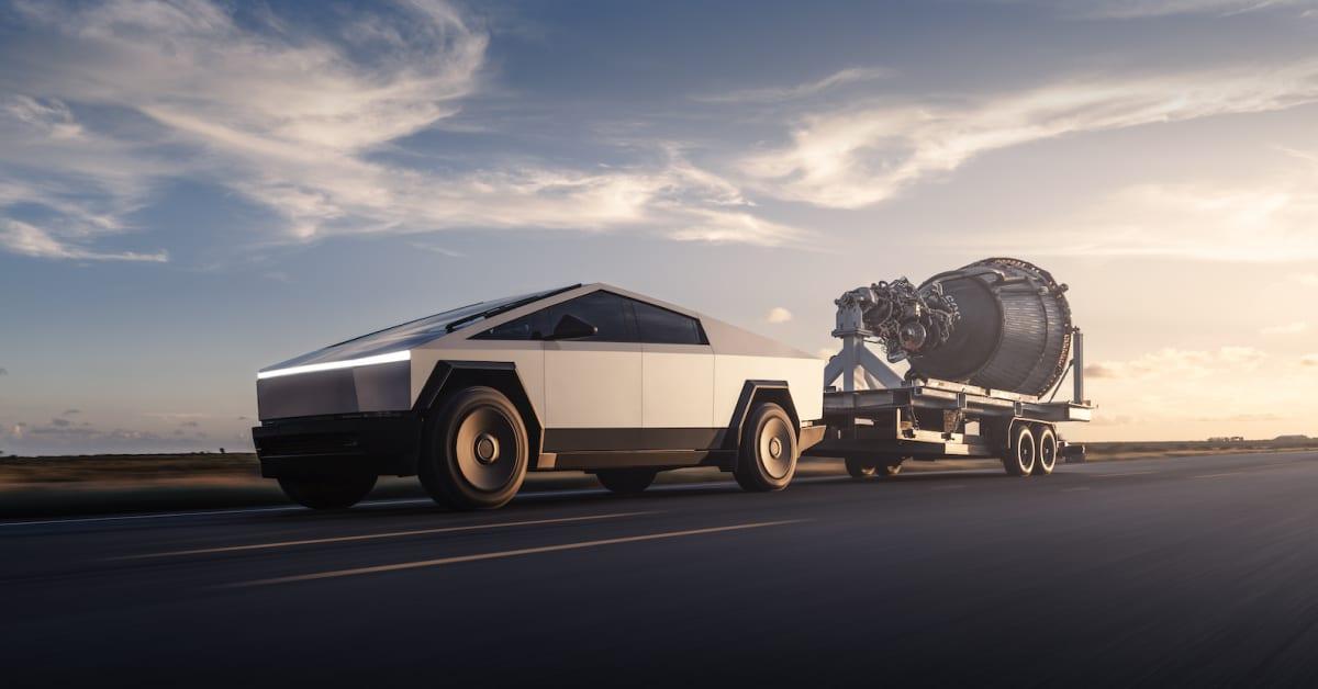 Tesla Cybertruck towing a rocket engine on a flatbed trailer