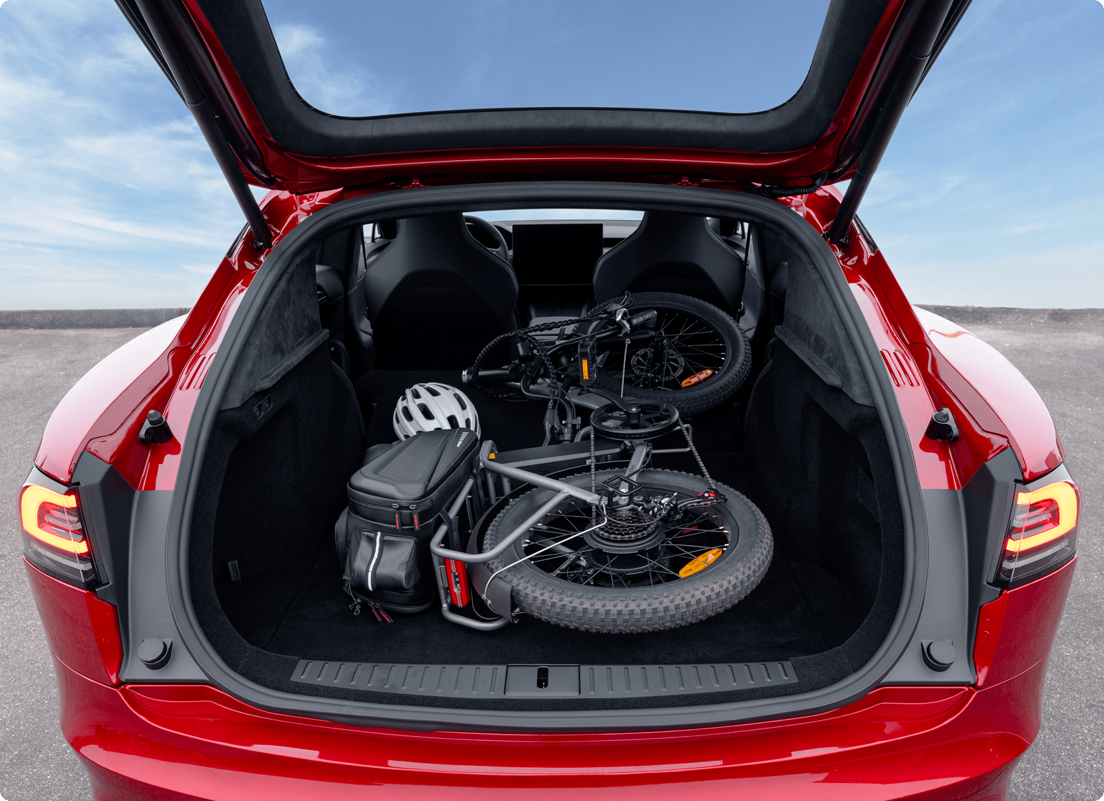 Tesla Model S cargo space — hatchback opening with folding e-bike