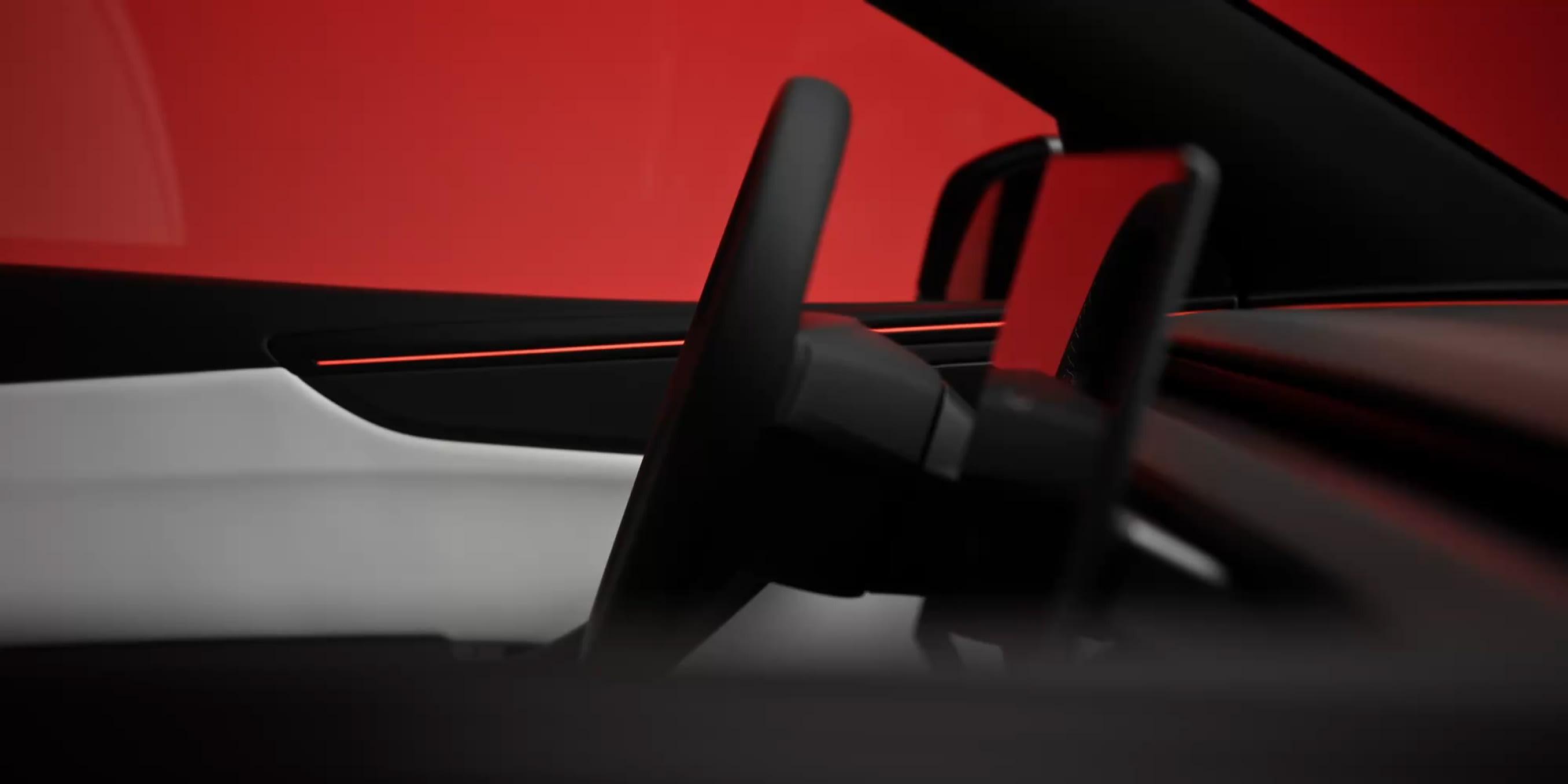 Tesla Model Y interior detail — ambient lighting and minimalist dash